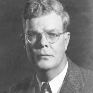 Baynard Kendrick author photo. Black and white headshot of man with glasses and short, wavy hair.