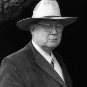 Erle Stanley Gardner author photo. Black and white image of a man with a large brimmed hat and glasses in 3/4 profile.