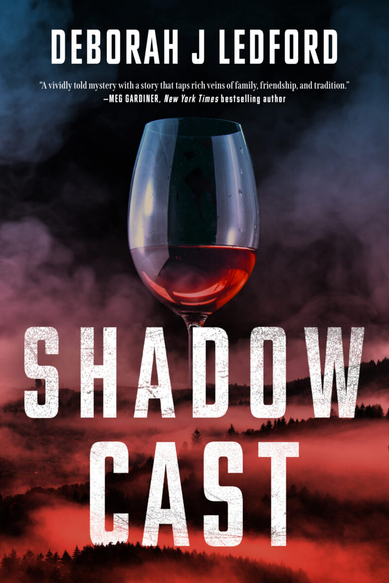 Cover of Shadow Cast by Deborah J Ledford. The Cover features an image of a wine glass in front of a natural landscape.